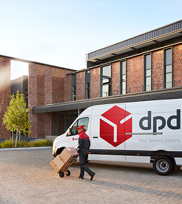 dpd driver and van delivering parcels into a building