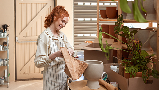 shop keeper packing parcel