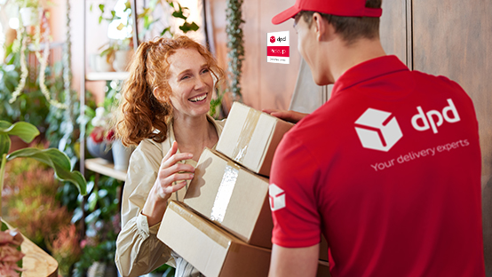 Driver handes over parcels to a pickup shop employee