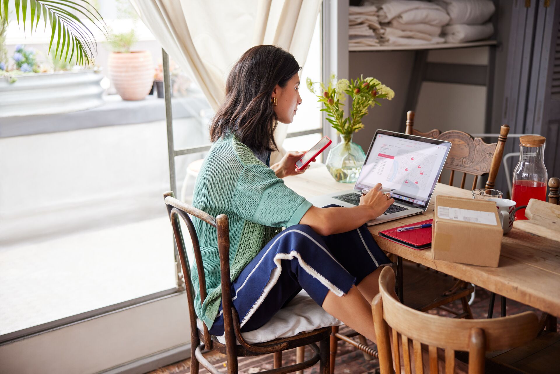 women sitting in front of laptop