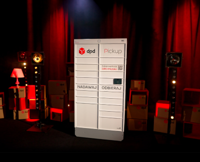 DPD Pickup parcel locker on a stage with red lighting and stage lights in the background