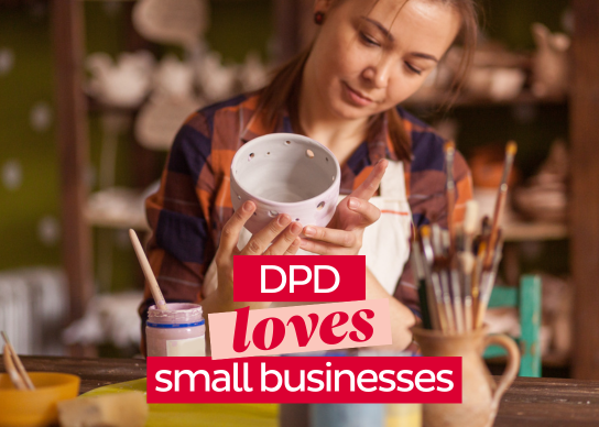 Woman wearing an apron paints a cup in a workshop. Headline: DPD loves small businesses.